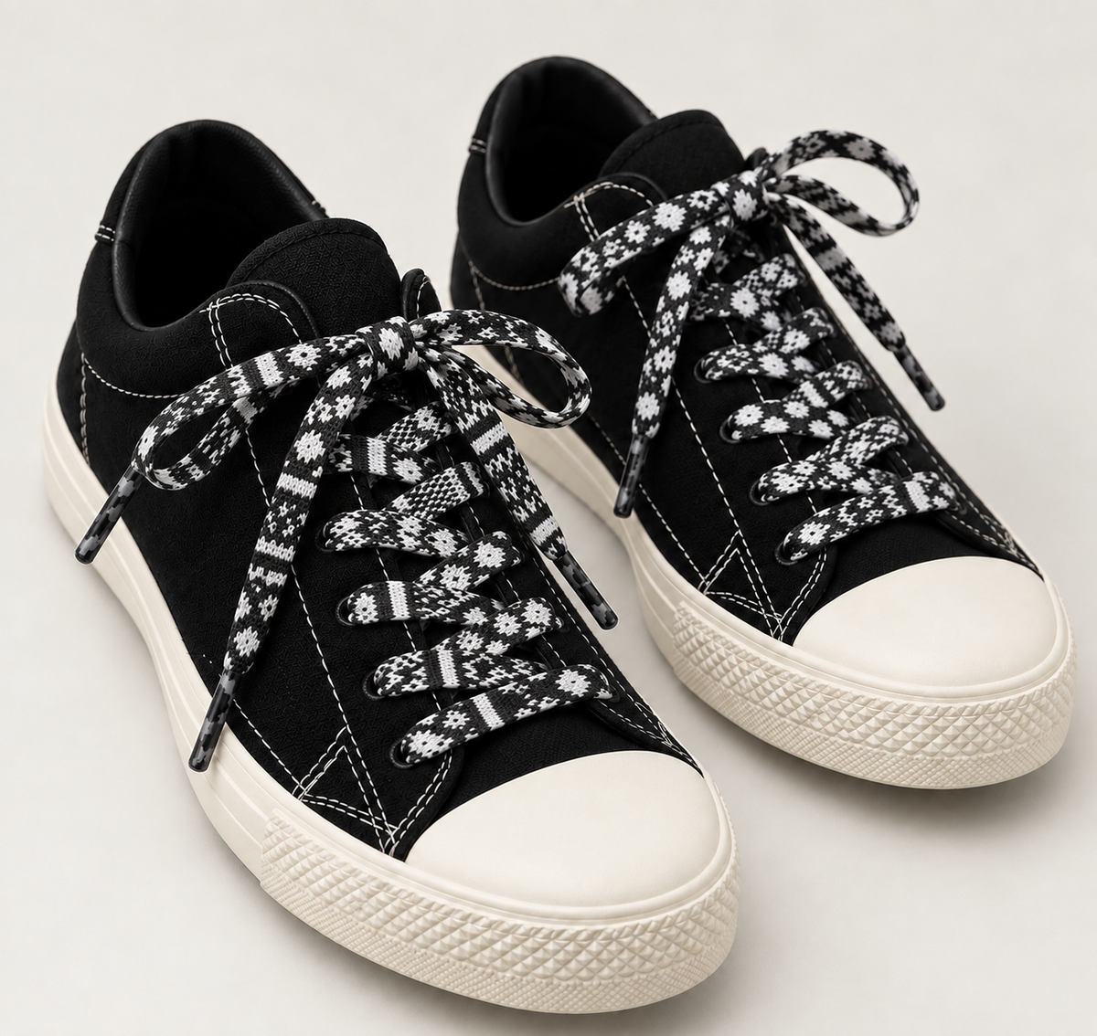 Black sneakers styled with KING keffiyeh flat shoelaces